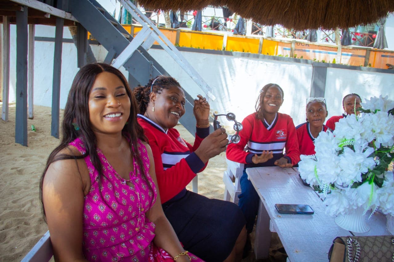Volunteers and community members laughing together during a Foundation outreach